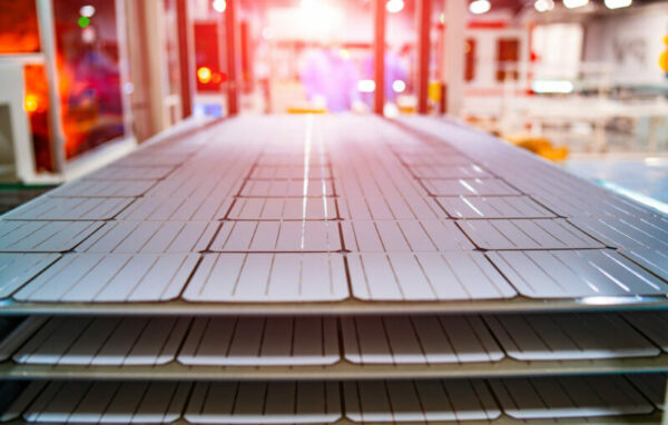 Manufacturing of solar panel system in factory. Industry concept.